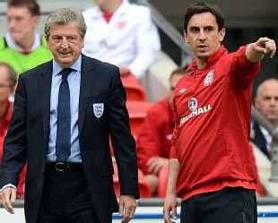 Roy Hodgson talks tactics with Gary Neville